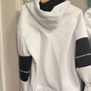 White and Black Hoodie with Text Detail